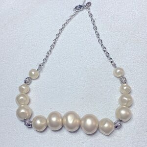 Gorgeous pearl necklace by Lia Sophia with silver beads with rhinestone.